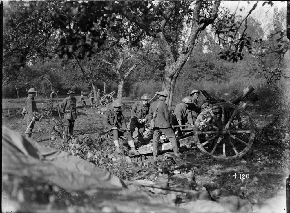 New Zealanders using 4.5 howitzers at an orchard in Le Quesnoy, France, 29 October 1918.
